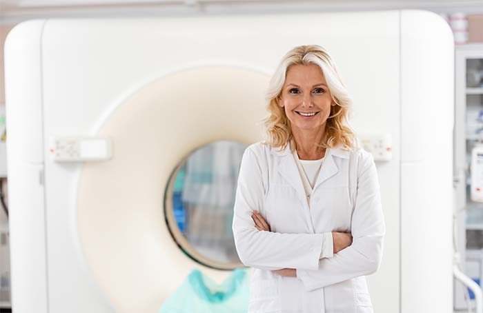 radiologist standing with arms crossed